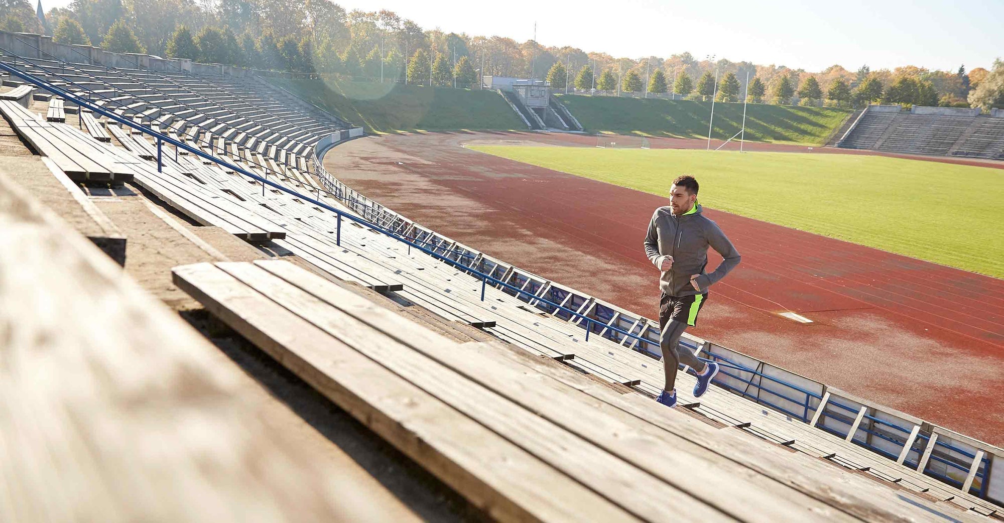 Man running up bleachers