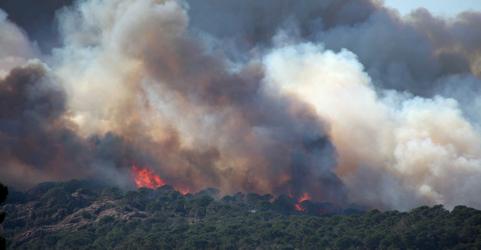 wildfire and smoke on hills