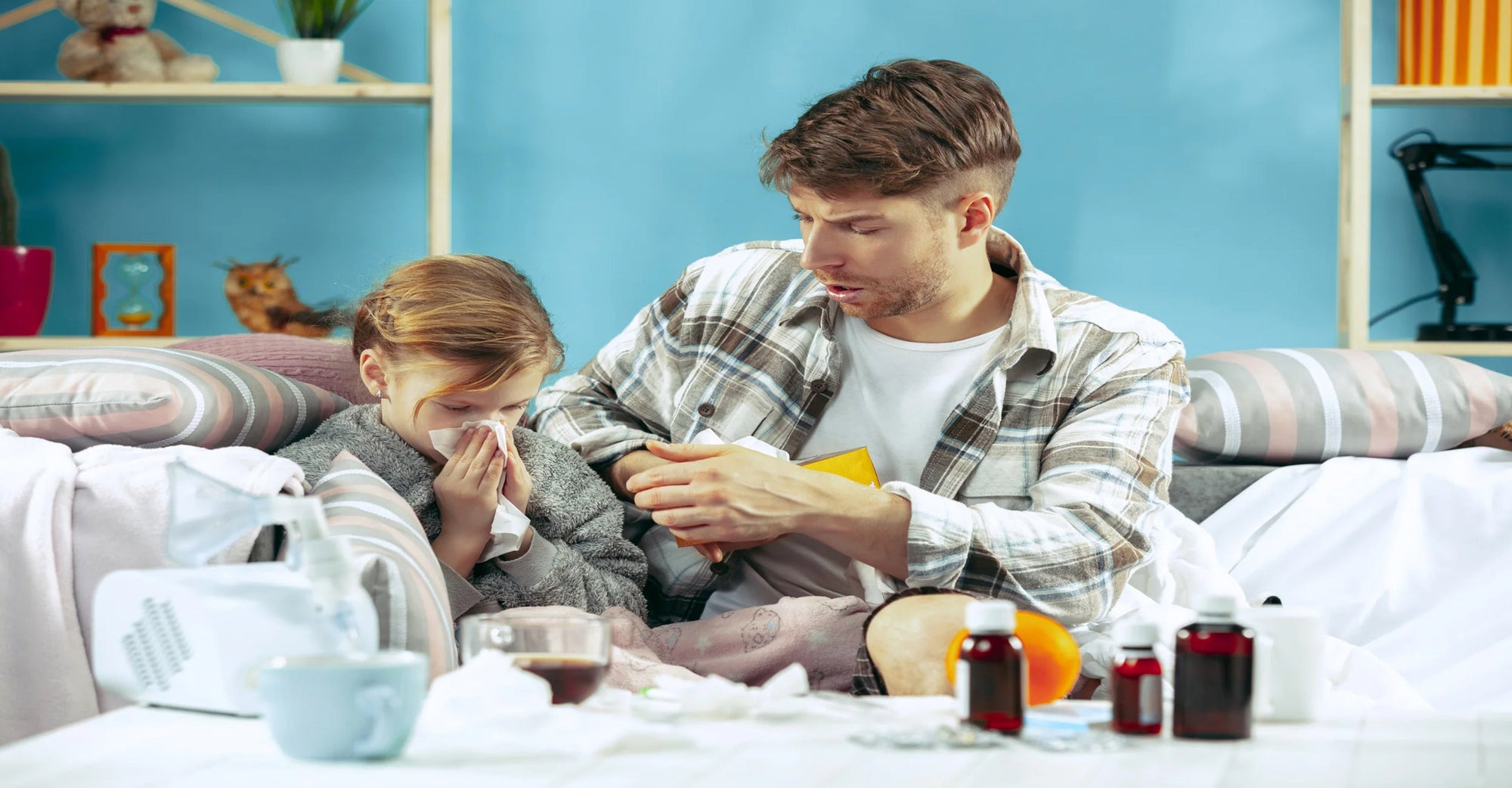 young dad with sick kid at home