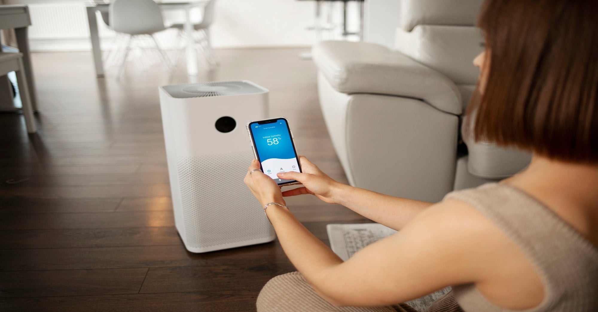 Woman Operating Air Purifier 