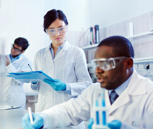 Lab technicians taking measurements in lab