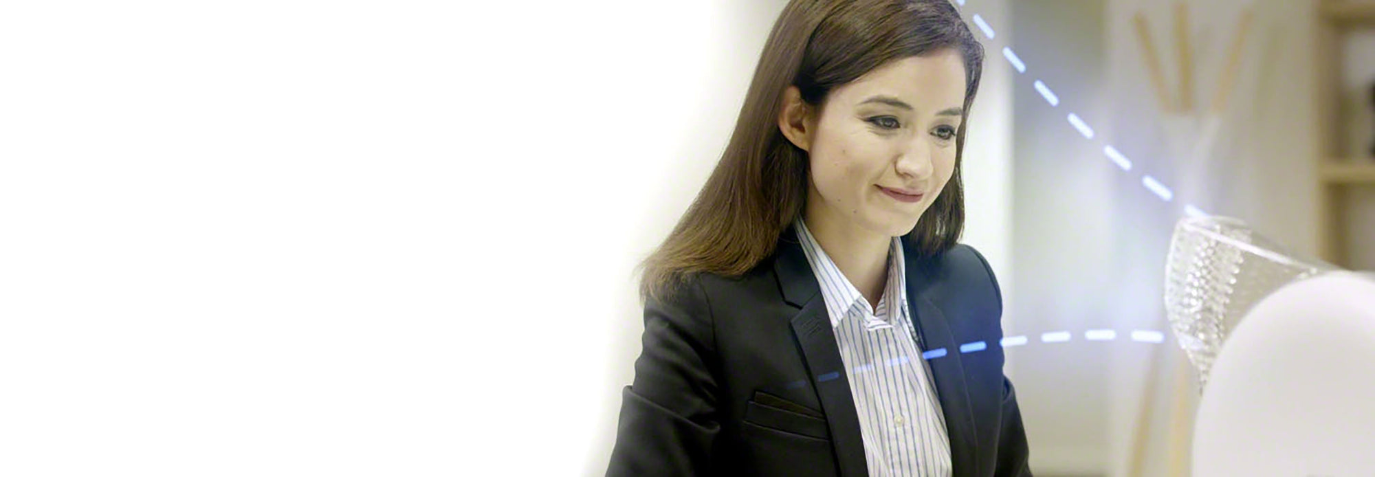 Woman in front of atem desk