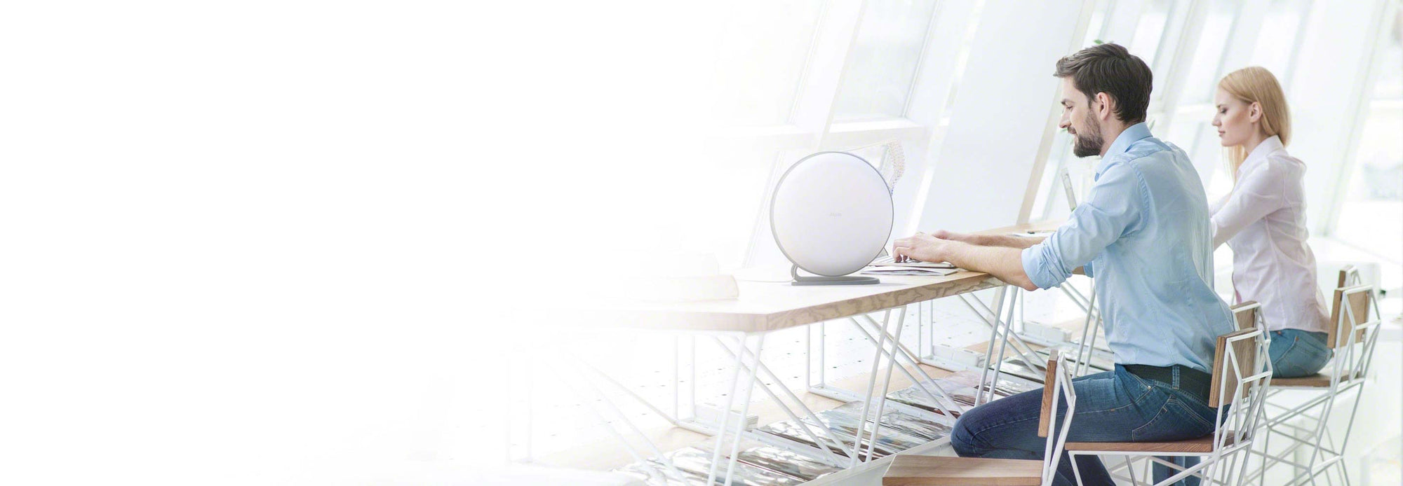 Atem desk on desk with man and woman working