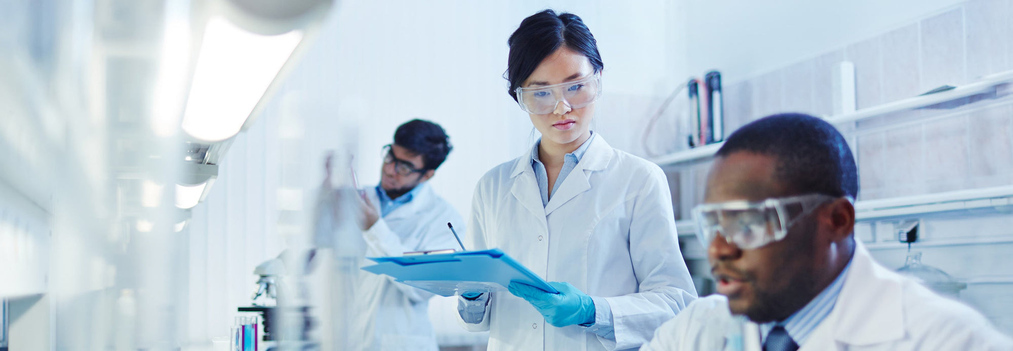 Lab technicians in lab inspecting products